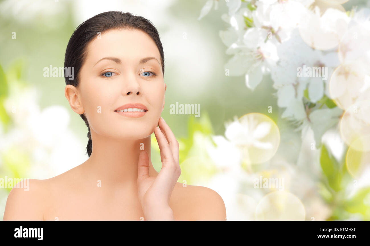 beautiful young woman touching her face Stock Photo - Alamy