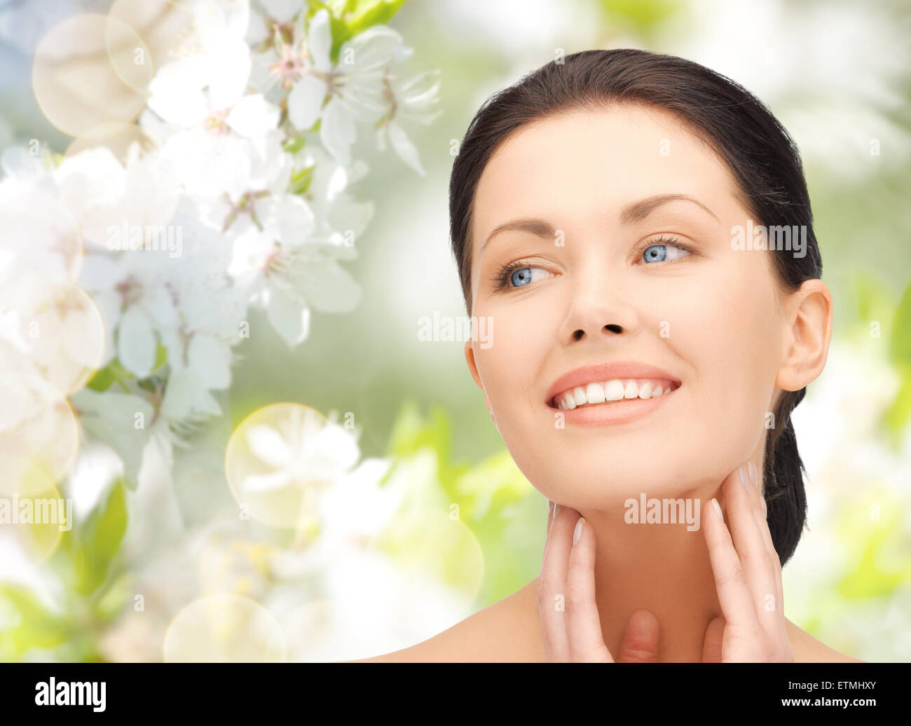beautiful young woman touching her face and neck Stock Photo - Alamy