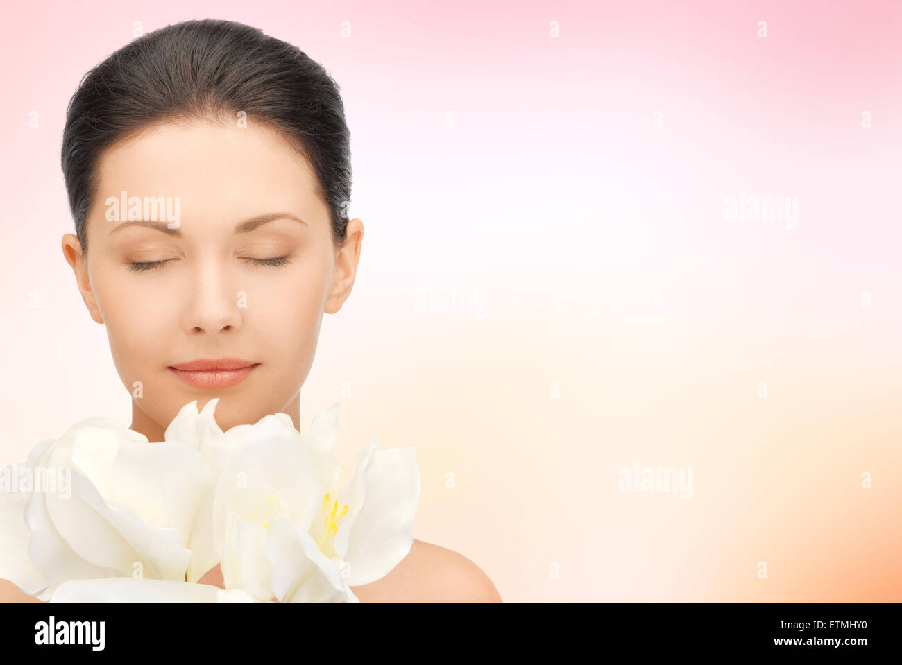 beautiful woman smelling flowers with closed eyes Stock Photo - Alamy