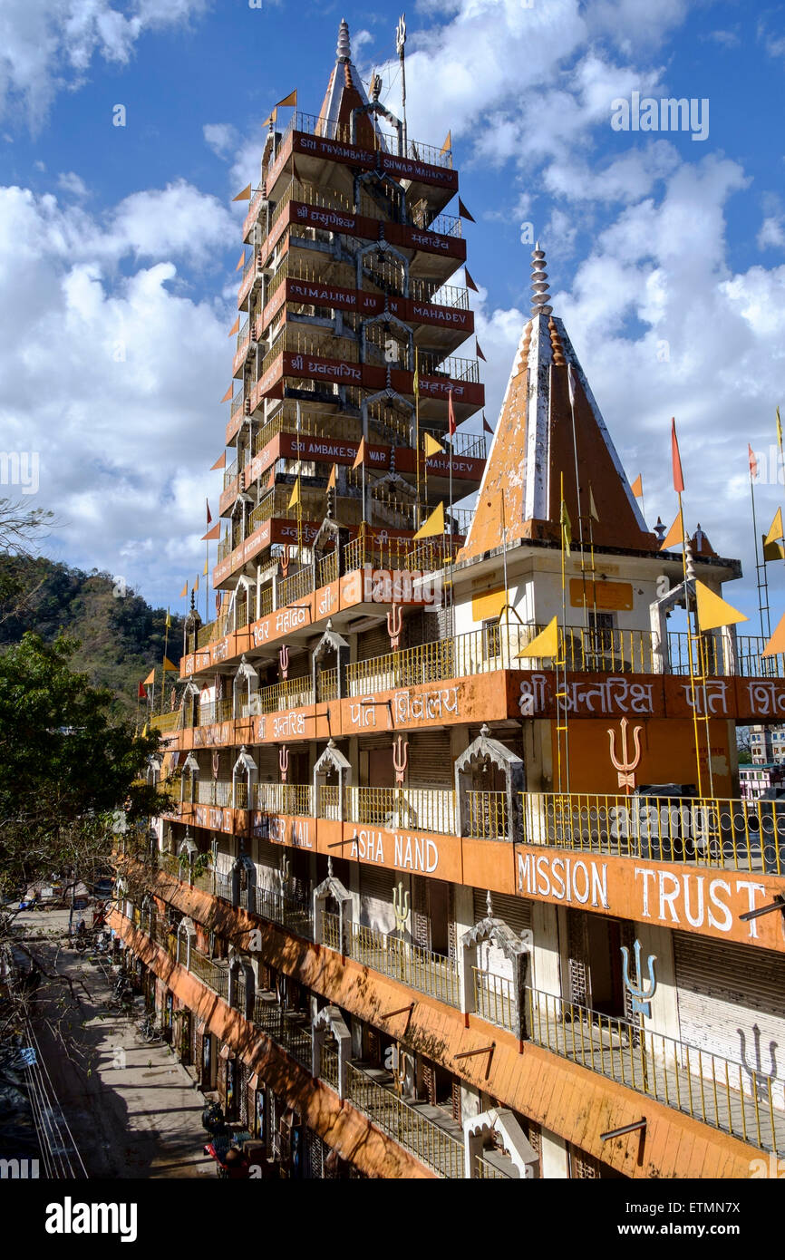 The Swarg Niwas Ashram, 13 storeyed temple on the bank of Ganges river near Laxman Jula, Rishikesh. Stock Photo