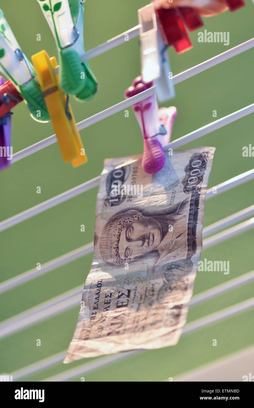 Berlin, Germany. 14th June, 2015. ILLUSTRATION - A 1000 Greek drachma bill hangs from a clothes line in Berlin, Germany, 14 June 2015. Photo: Jens Kalaene/dpa/Alamy Live News Stock Photo