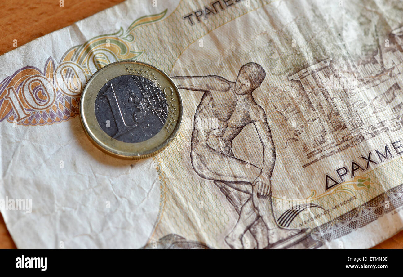 Berlin, Germany. 14th June, 2015. ILLUSTRATION - A euro coin is placed on a 1000 Greek drachma bill in Berlin, Germany, 14 June 2015. Photo: Jens Kalaene/dpa/Alamy Live News Stock Photo