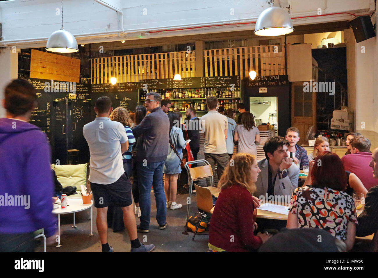 Customers inside The Nines, a pop-up bar in a converted Peckham warehouse behind the famous Bussey Building. South east London, UK Stock Photo