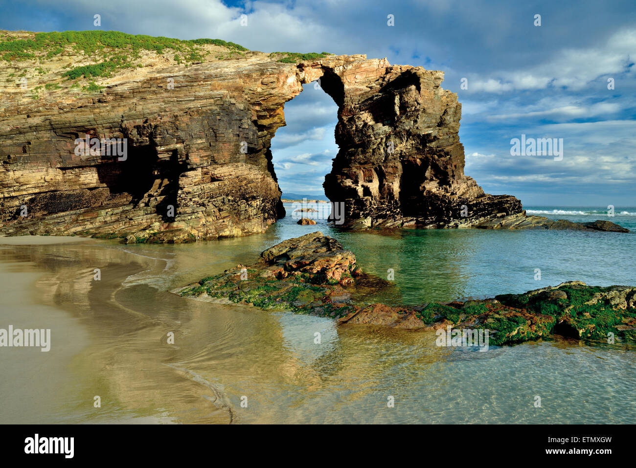 Spain, Galicia: Rock arc at beach Praia As Catedrais Stock Photo