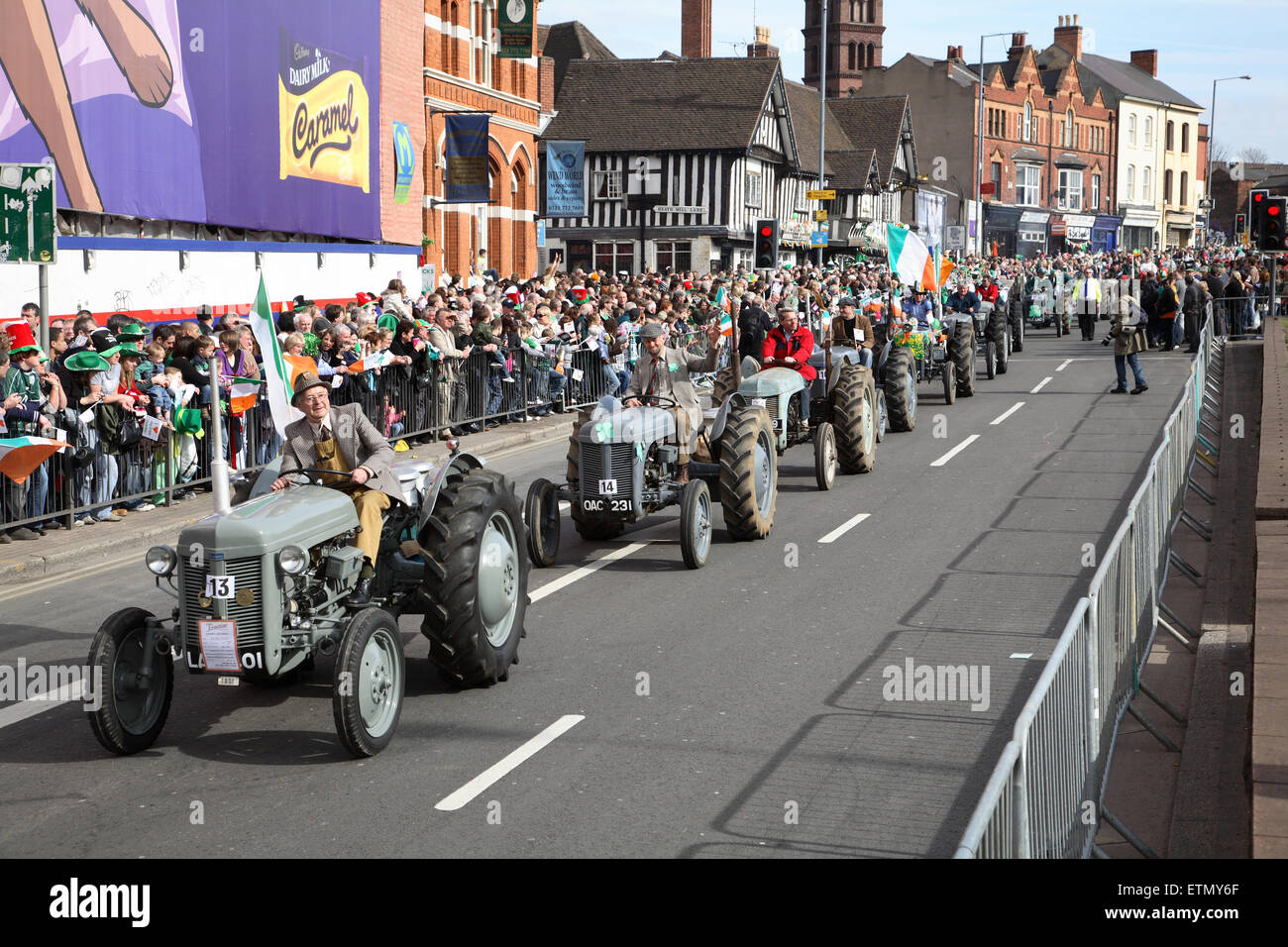 A parade of vintage tractors at Birmingham's St Patrick's Day celebrations Stock Photo