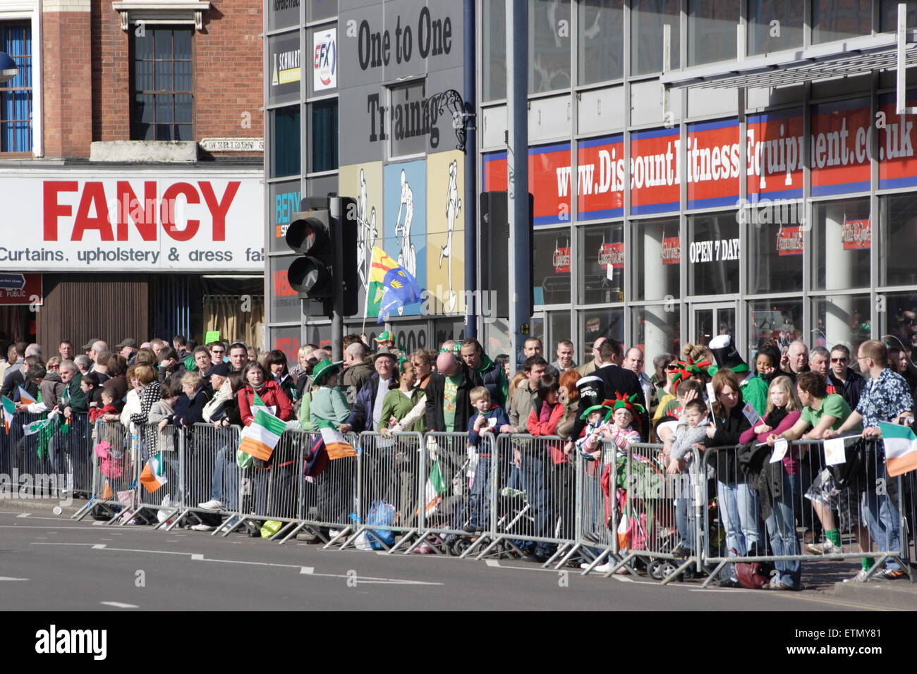 crowds awaiting the precession at Birmingham's St Patrick's Day parade Stock Photo