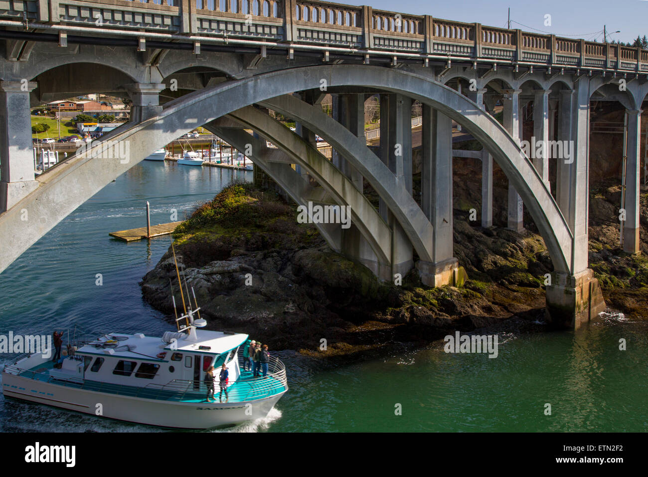 WhaleWatching boat exits the tiny harbor of Depoe Bay, Oregon, USA