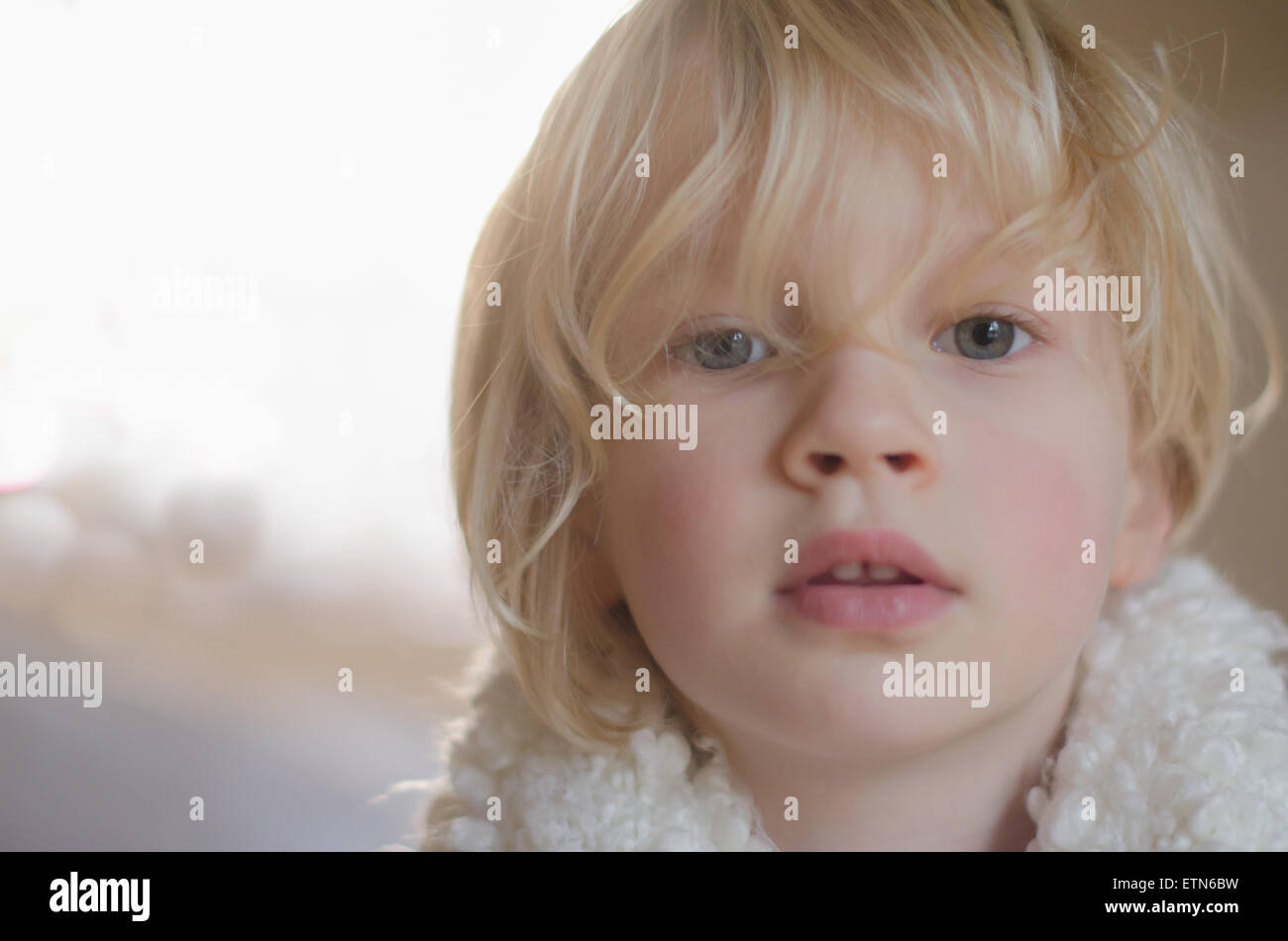 Portrait of a boy looking at camera Stock Photo - Alamy