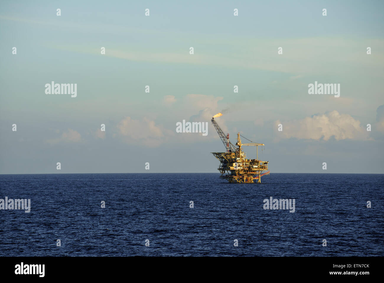 Offshore oil platform in operation at sea Stock Photo