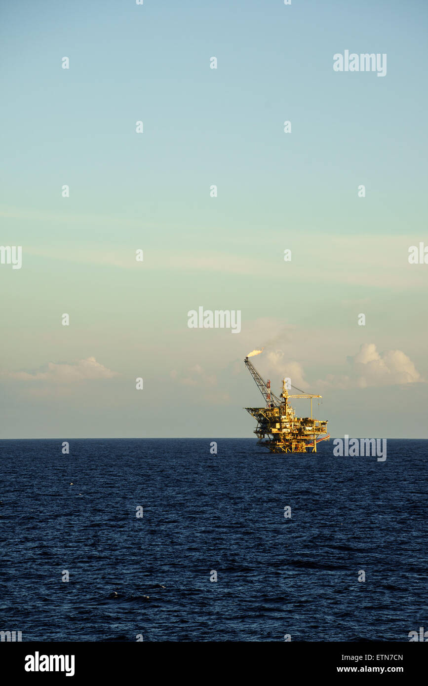 Oil processing platform with funnel flare Stock Photo