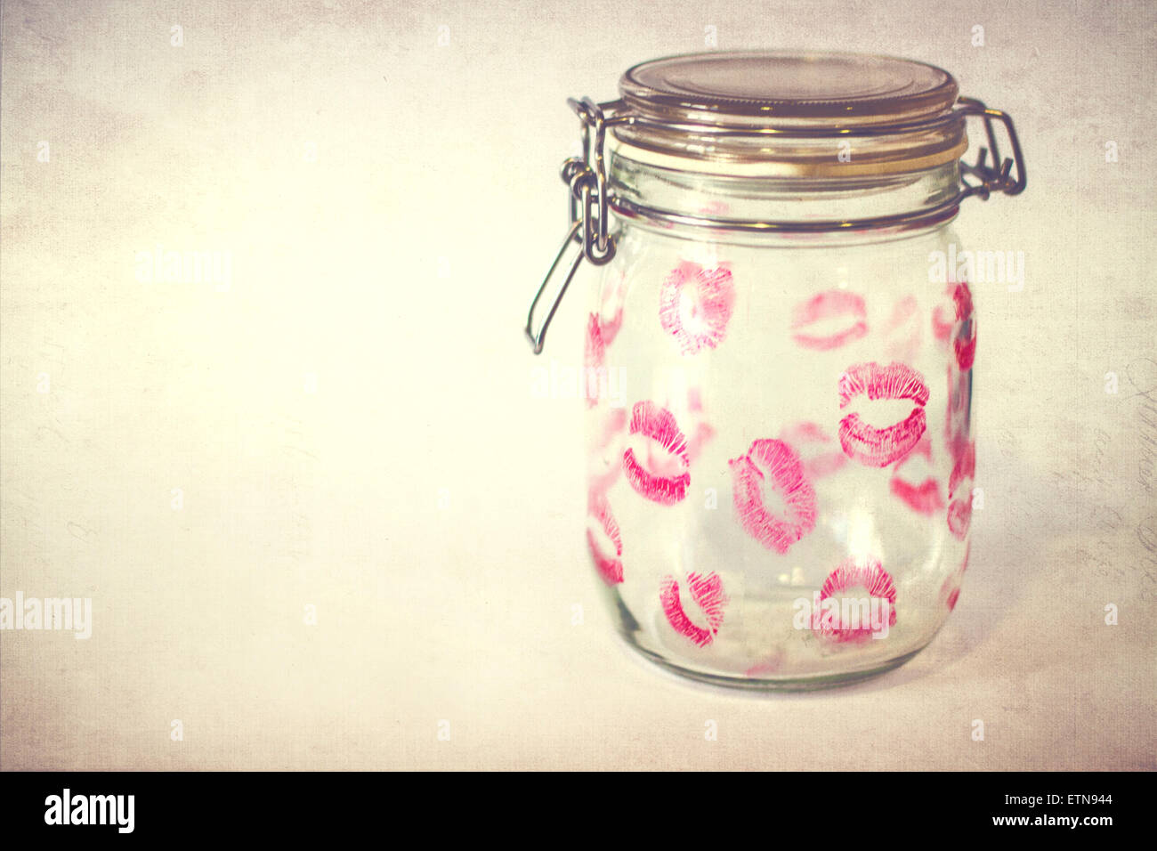 Glass jar covered in  lipstick kisses Stock Photo