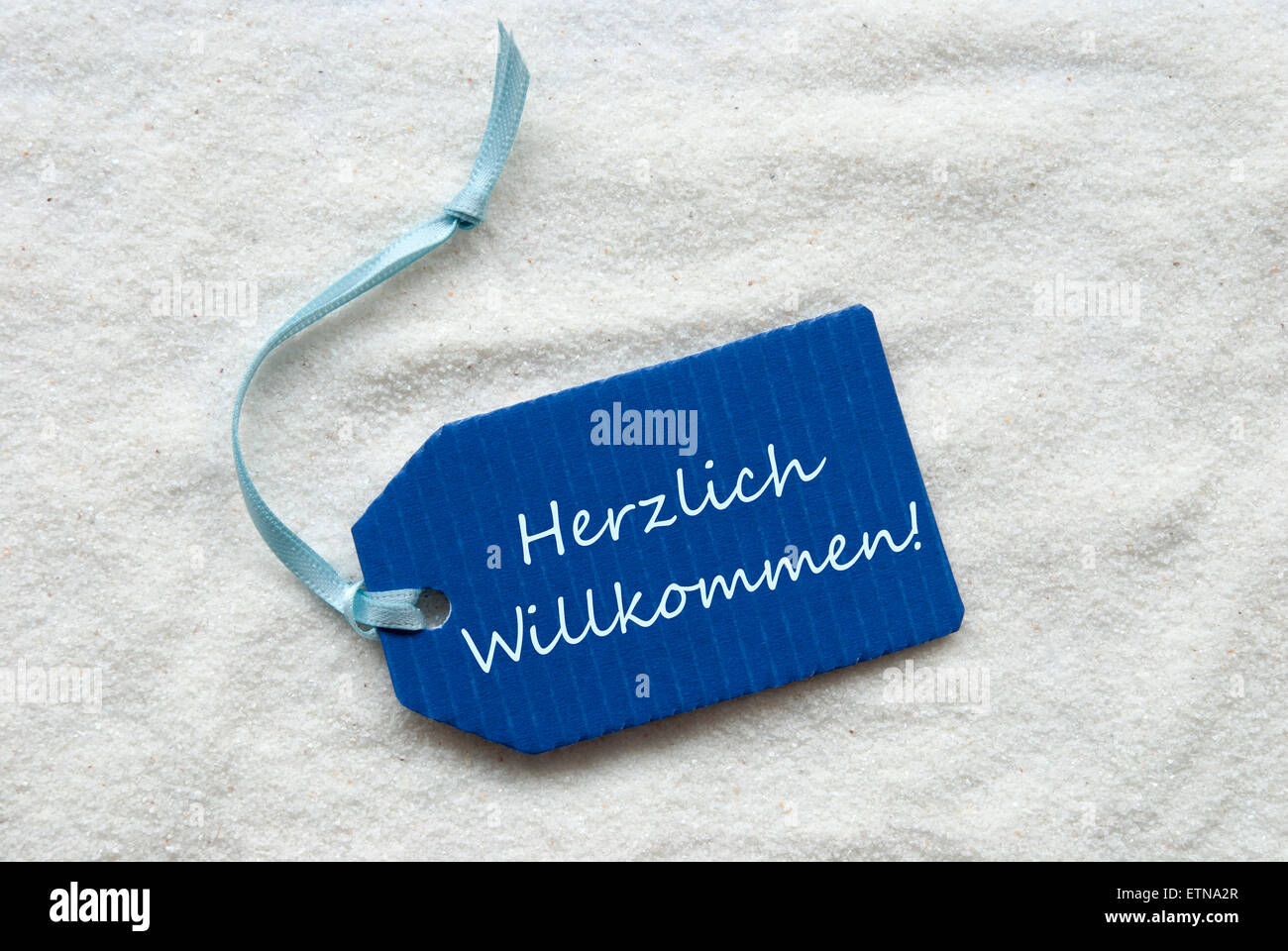 Herzlich Willkommen Means Welcome On Blue Label Stock Photo
