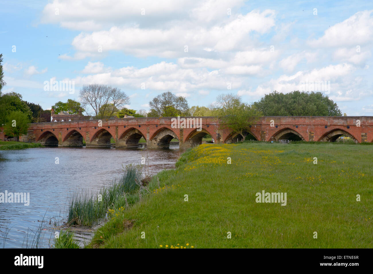 The 15th Century Great Barford Bridge over the River Ouse in Great Barford, Bedfordshire, England on a sunny day Stock Photo