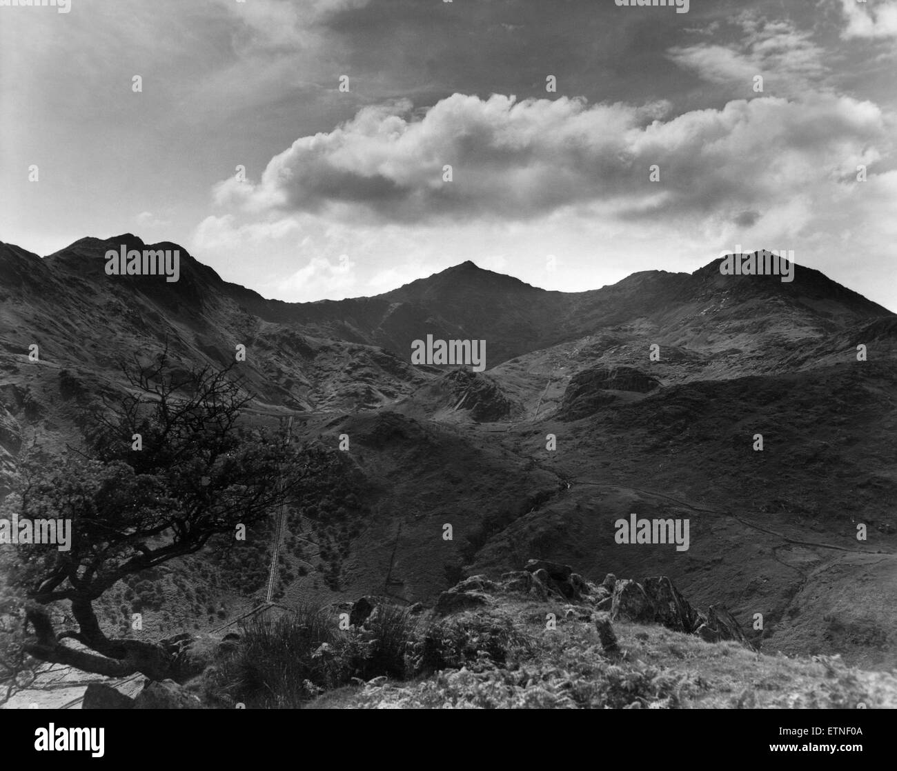 Snowdon (centre) with Lliwedd (left) and Crib Coch (right) from the Nant Gwynant Pass, near Beddgellert, North Wales. 26th June 1959 Stock Photo