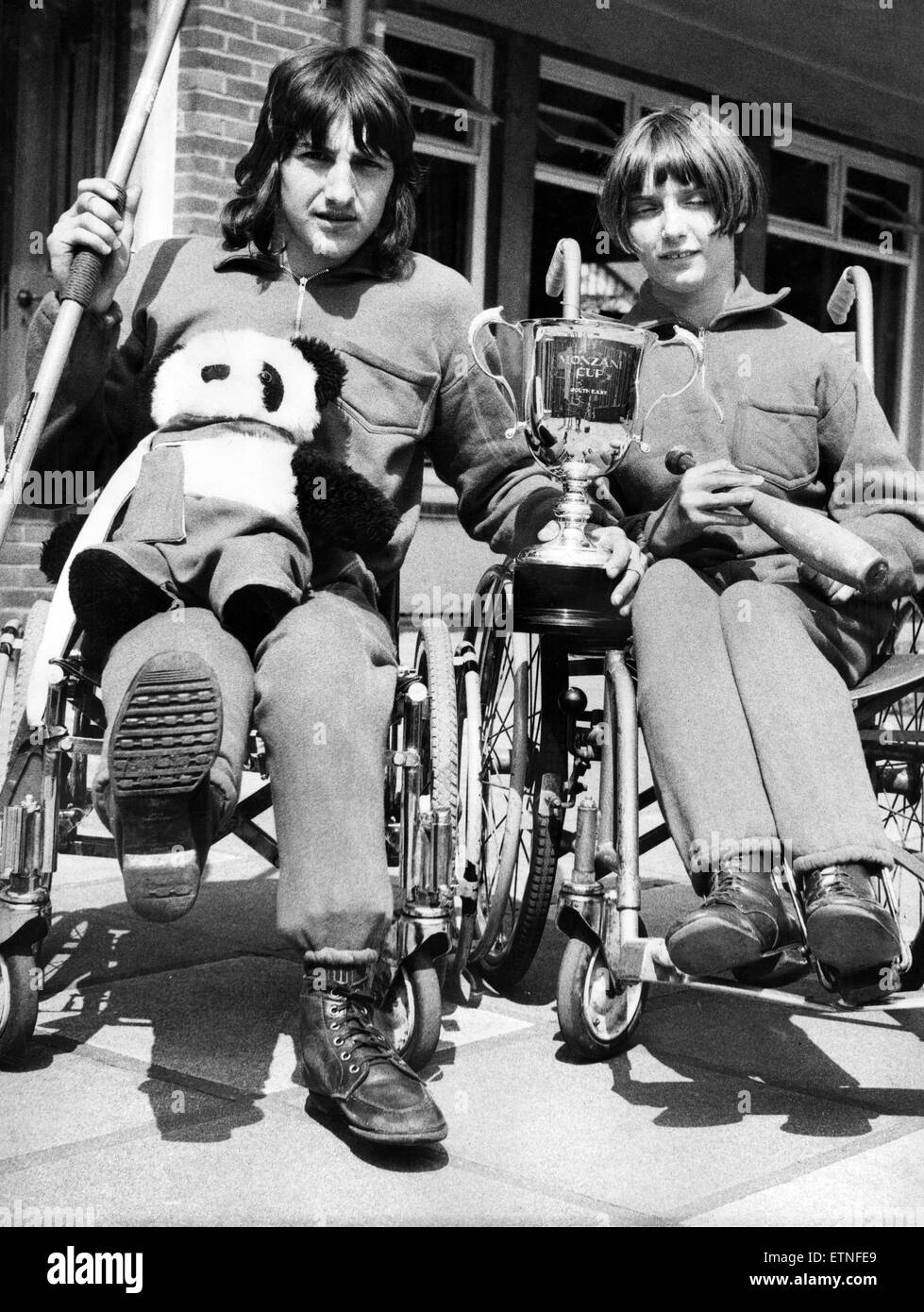 Two wheelchair champions from the Percy Hedley School in Newcastle show off the cup which the region won at the third National Spastic Games. The school takes the trophy because, although it was awarded to the North East region, the Percy Hedley athletes Stock Photo