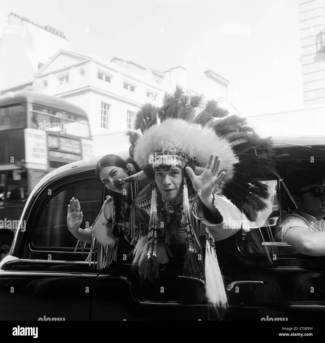 Couple of actors dressed as an Indian Chief and his Squaw, pictured leaving New Zealand House after press conference, 23rd September 1965. They are part of the Canadian National Folk Ensemble who are in the show Les Fux Follets at the Piccadilly Theatre. Stock Photo