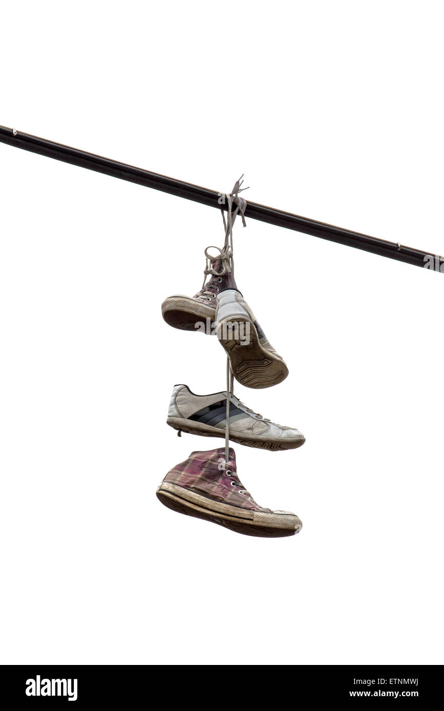 Shoe Tossing Old Sneakers Hanging on Powerline Wire Isolated on White Background Stock Photo Alamy