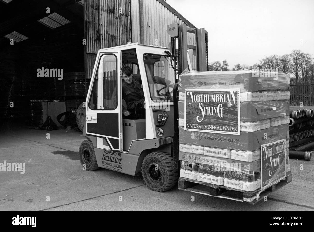 Aqua Trading Company 6th March 1989. Sean Bates folk lifts another consignment of the bottled nectar, Northumbrian Spring Water. Stock Photo