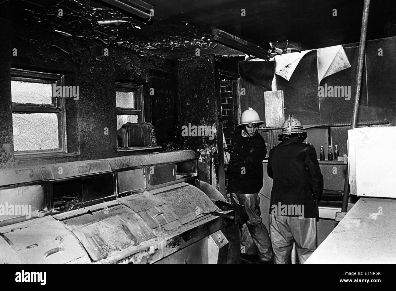 Firemen make safe the fish shop on Scurfield Road, Stockton, after extinguishing a fire caused when the fat being heated caught fire, causing extensive damage, 21st July 1980. Stock Photo