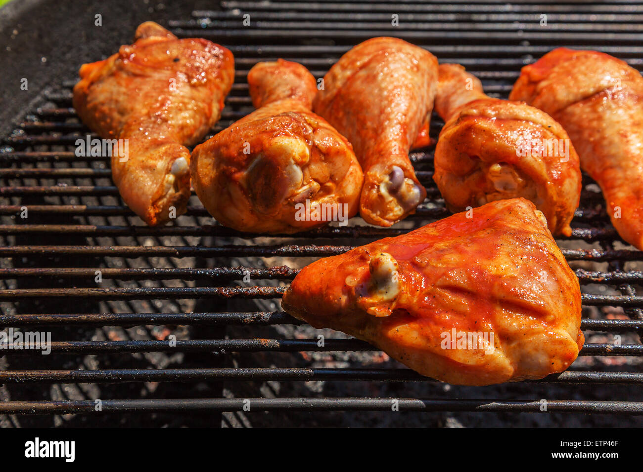 Chicken legs smoked barbecue cooked on charcoal grill Stock Photo Alamy