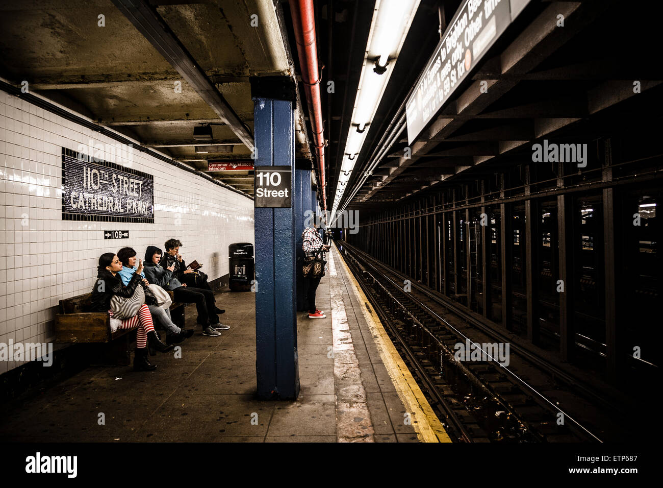 Commuters waiting on platform on the NYC Subway Stock Photo