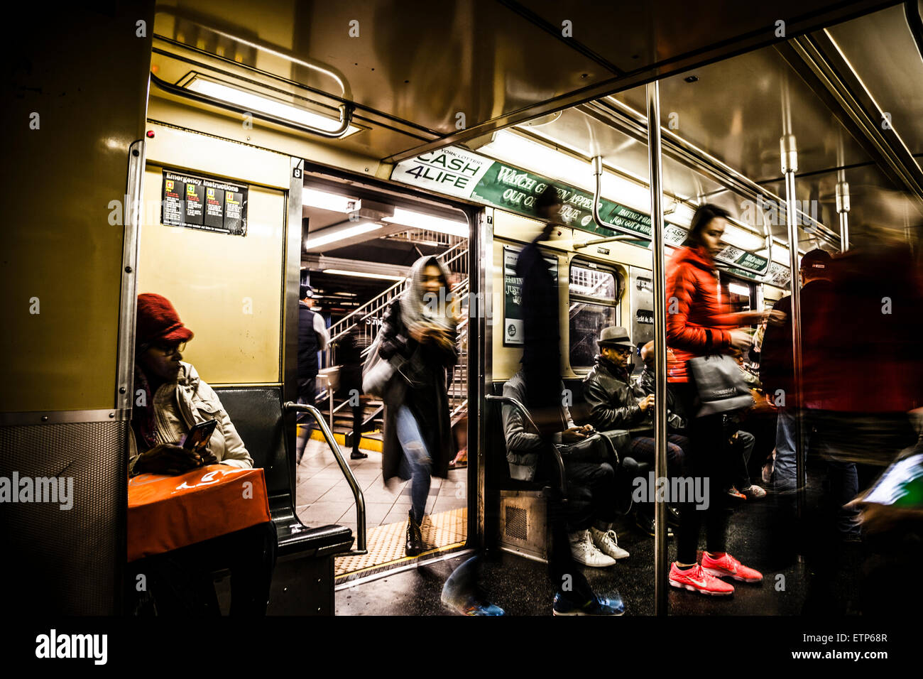 Commuters in subway wagon at New York subway Stock Photo