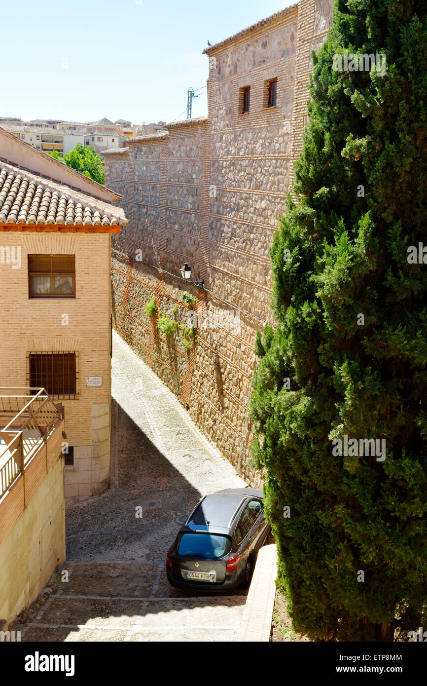 Car parked on one of the narrow cobbled streets in Toledo, Spain where