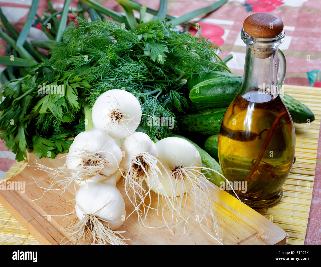 Still-life with onions cucumbers and olive oil Stock Photo