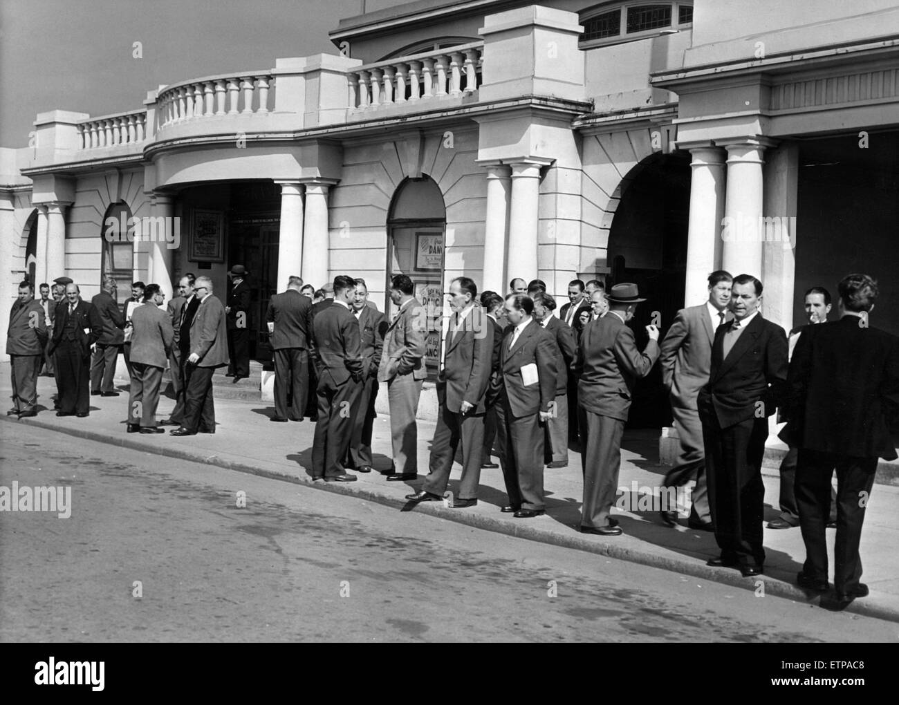 Miners wait outside of the Pavilion at Porthcawl, for the annual NUM South Wales miners conference, Porthcawl, Bridgend, South Wales, 1st May 1962. Stock Photo