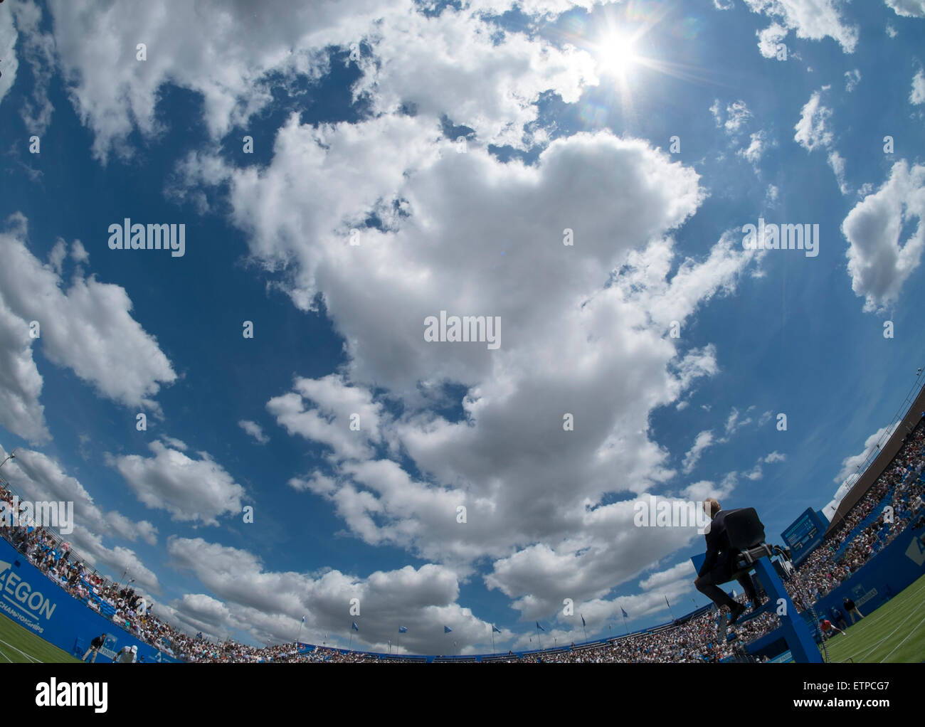 The Queen’s Club, London, UK. 15th June, 2015. As a prelude to the Wimbledon Championships, play begins at The Queen’s Club for The Aegon Championships on grass courts with many of the top men appearing over the week of matches. Fisheye view of centre court with umpire. Credit:  Malcolm Park editorial/Alamy Live News Stock Photo