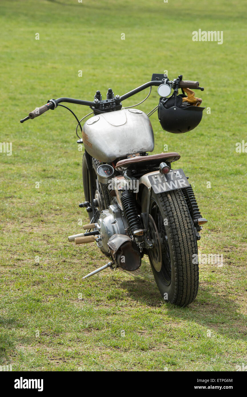 Old Harley Davidson motorcycle in a field Stock Photo
