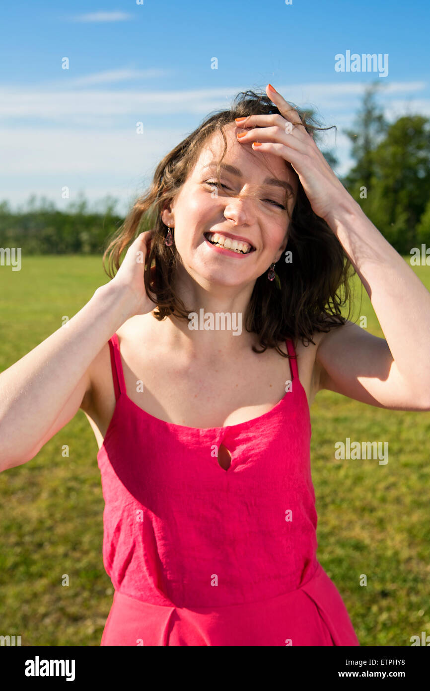 Young female smiles flirty to a camera Stock Photo
