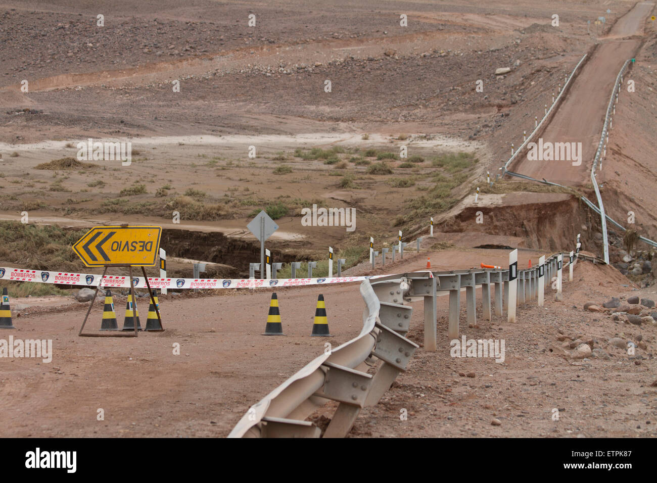 Upside Down Detour sign in front of broken road, Northern Chile Stock Photo