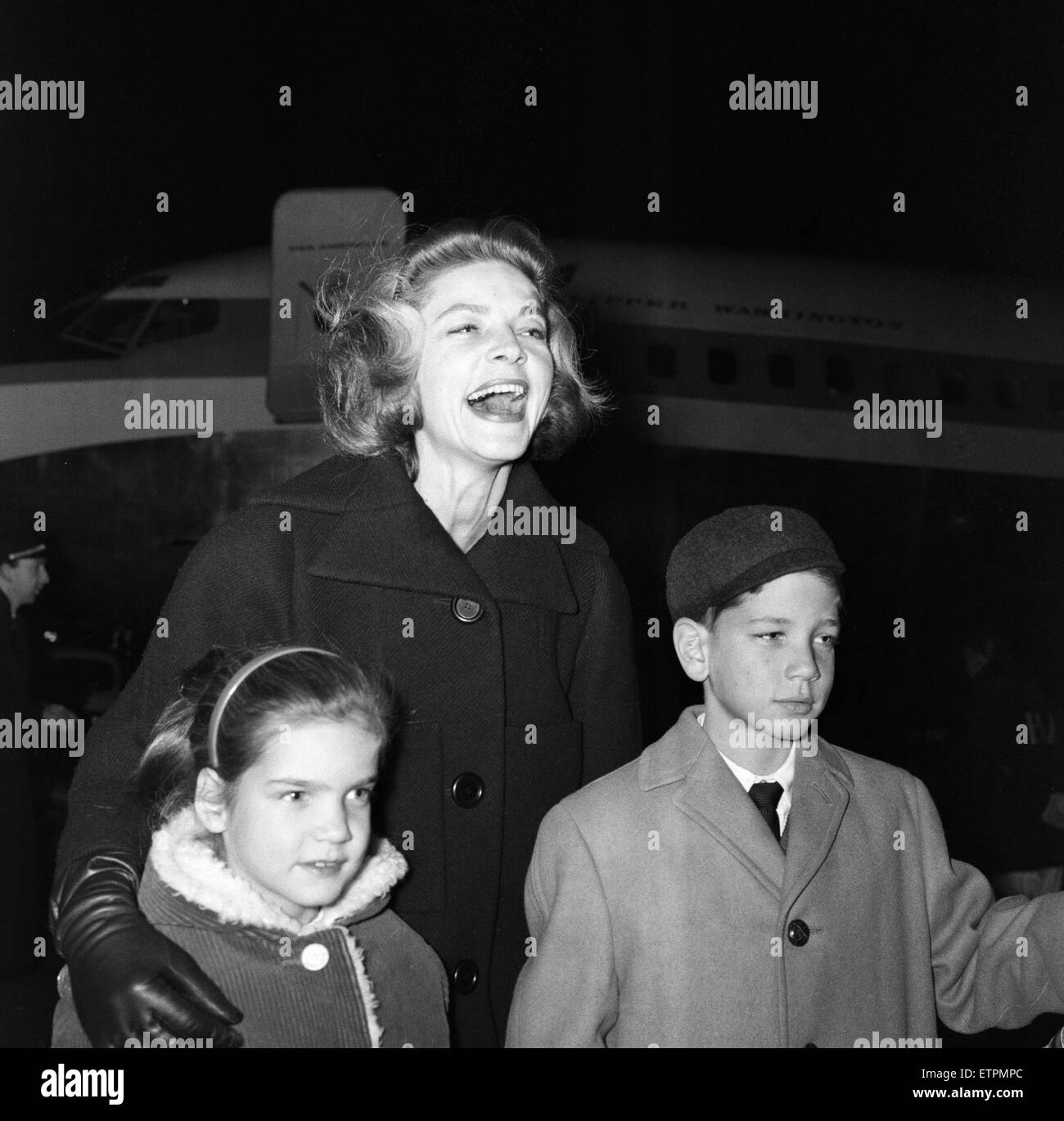 Lauren Bacall at London Airport with her two children, Stephen (aged 10) and Leslie (aged 6). 9th January 1959. Stock Photo