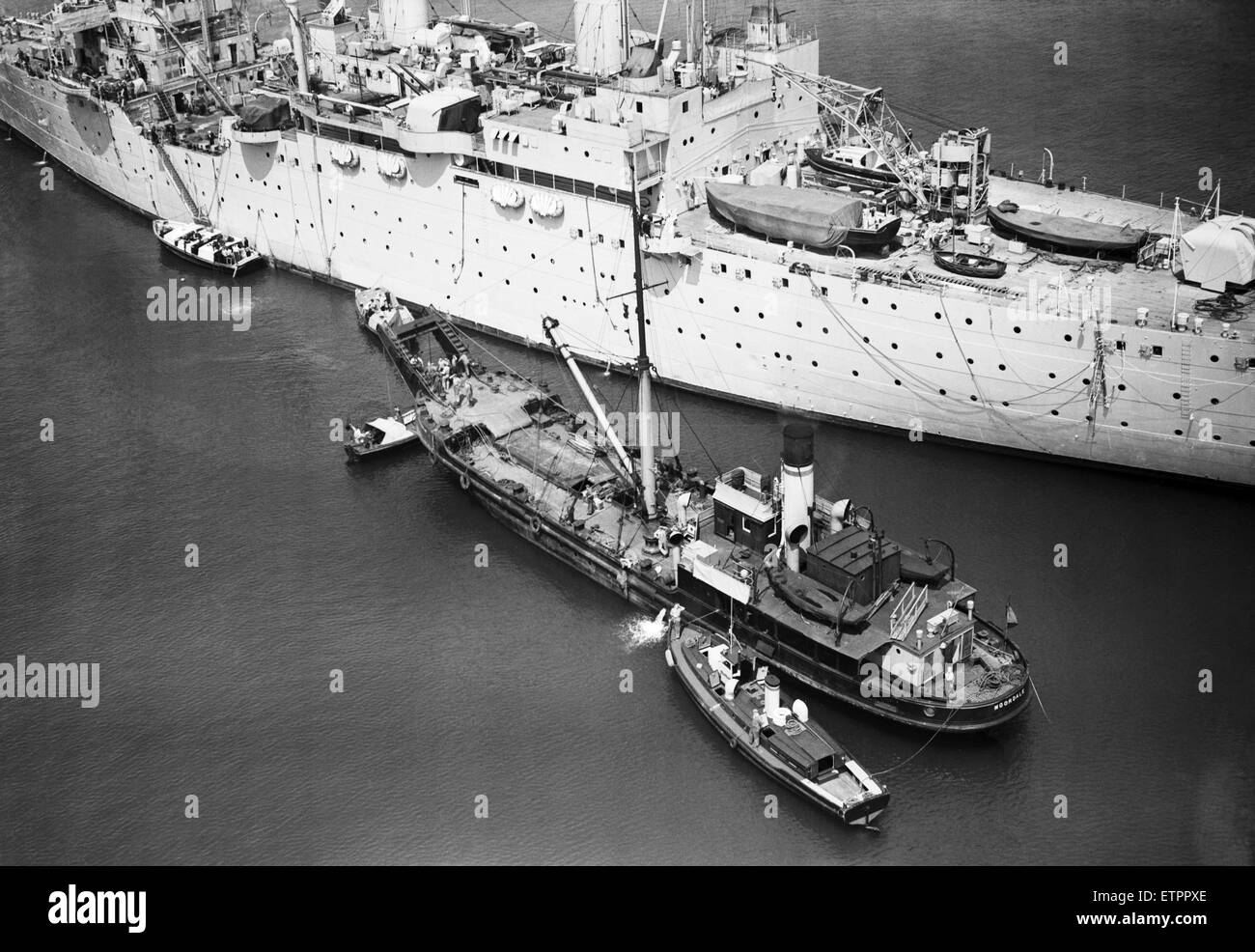 HM Submarine Sidon sank in Portland Harbour after an explosion. She was moored alongside the HMS Maidstone at the time. Pictured, the salvage operation. 16th June 1955. Stock Photo
