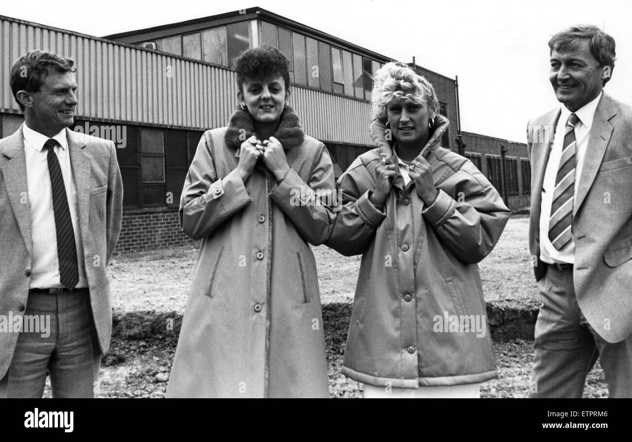 Fanous raincoat manufacturers Dannimac are making a massive £800,000 vote of confidence in Teesside by siting their main UK factory in the area. John Webber, right, and Middlesbrough manager Michael Hodgson, admire coats modelled by Middlesbrough factory machinists Kathryne Barnes and Jeanette Hurst. 22nd June 1988. Stock Photo