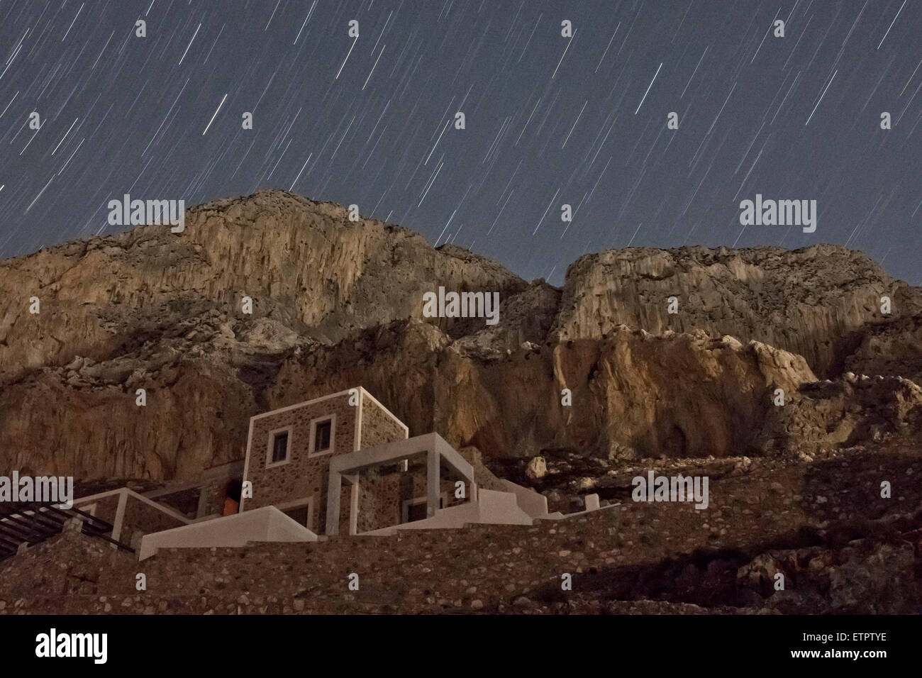 House under rock, night photograph with stars, Greece, Kalymnos