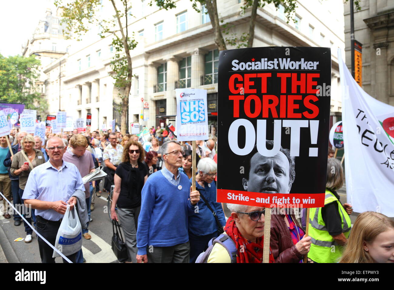 A protester holds a 'Get the Tories Out' placard during a demonstration in London. Stock Photo