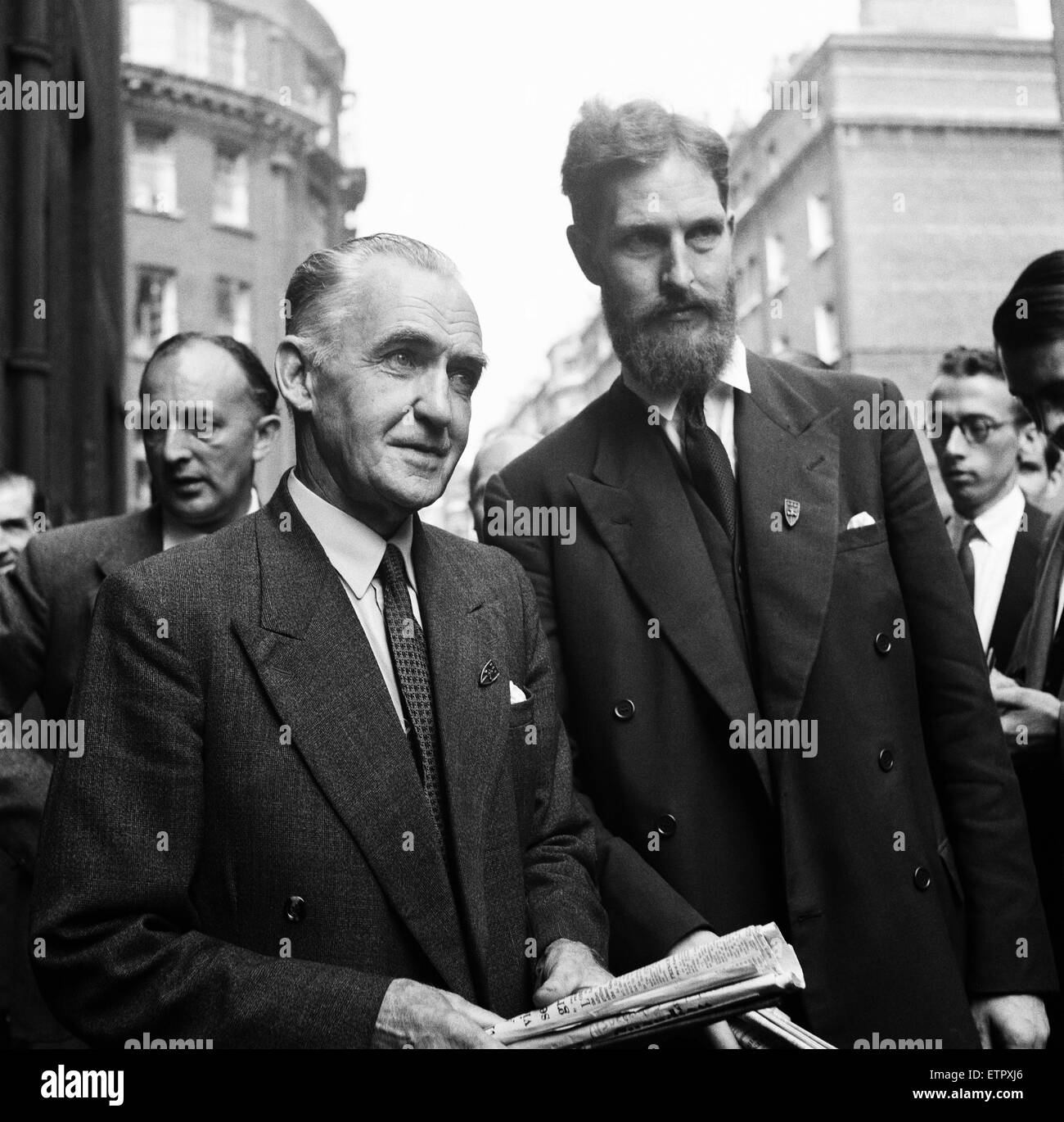 Pictured, Philip Kinghorn Burbridge with Mr Austen Brooks (with beard), a member of The League of Empire Loyalists.  Mr Philip Kinghorn Burbridge, who slapped Lord Altrincham (critic of the Queen), as he came out of Television House, London. 7th August 19 Stock Photo