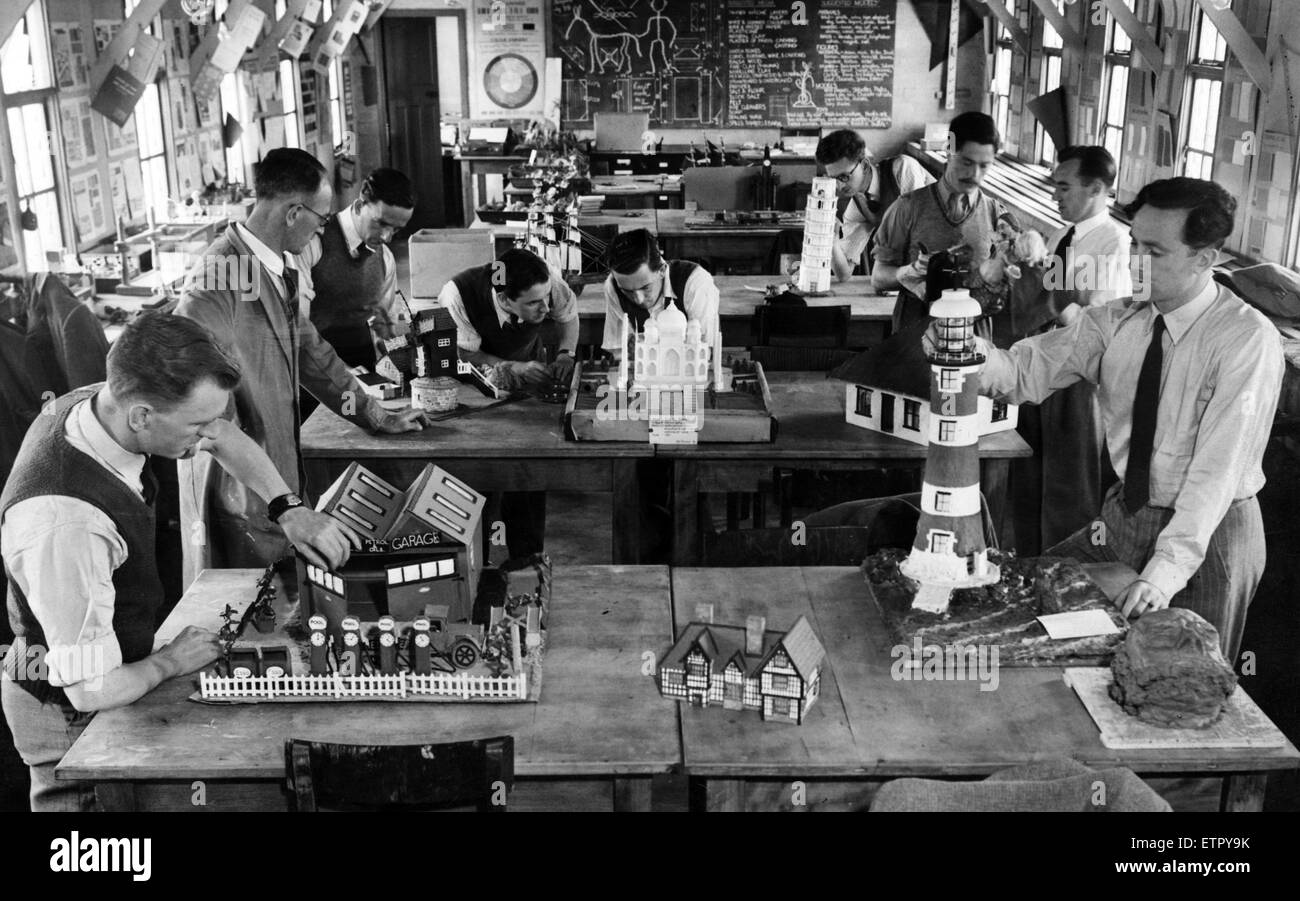 To-morrow's teachers are practical men. Some of the student teachers at Kirkby Emergency Training College with models they have made from waste materials. To construct the lighthouse, a jam jar, an ash tray and an ointment tin were used. 23rd June 1948. Stock Photo
