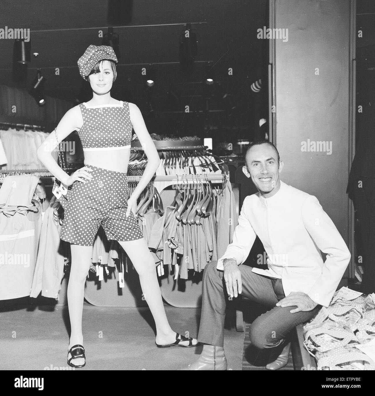 Way In the new unique 20,000 square foot boutique planned by Sir Hugh Fraser for the fourth floor of Harrods set to open on the 7th June 1967. Designer Ruben Torres who is putting on a show of his clothes is seen here with model Shoula Tevet wearing an outfit called 'Chocolate Chip'. 5th June 1967 Stock Photo