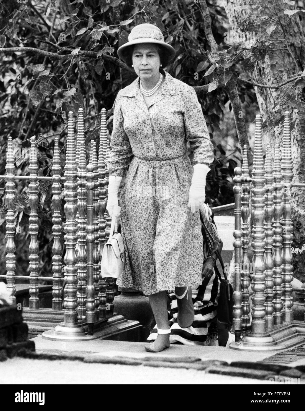 Royal Visit of Queen Elizabeth II and Prince Philip, Duke of Edinburgh to Sri Lanka at the end of their tour of Australasia. Pictured: The Queen wearing a pair of Air New Zealand socks produced as an emergency measure when entering a Buddhist temple.  After removing her shoes to enter the temple, as religion dictates, her aides suddenly realised she had nothing to cover her feet.  The day was saved when the airline's socks were produced. 26th October 1981. Stock Photo