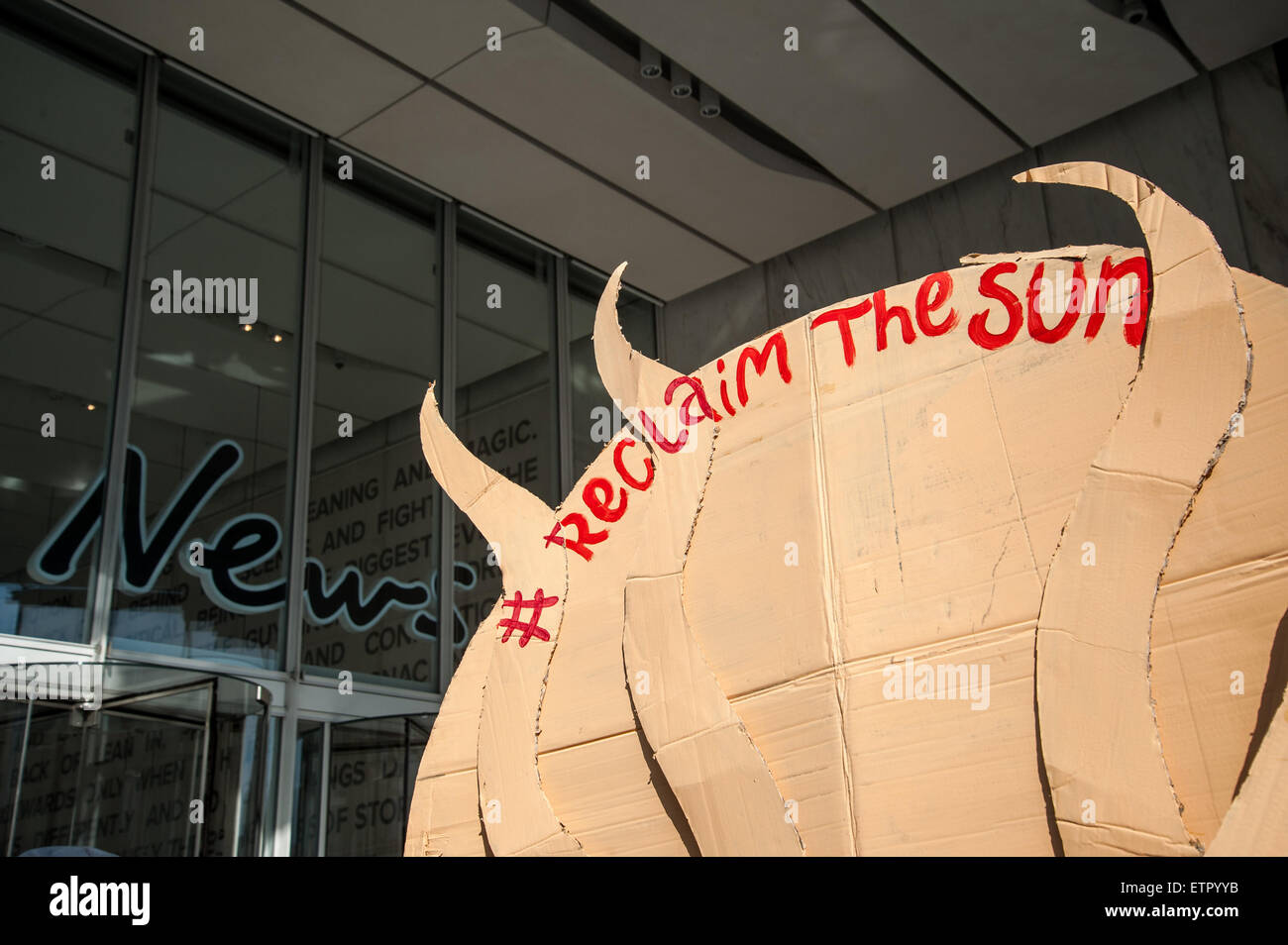 Occupy protesters gather outside the headquarters of News UK, owners of the Sun newspaper to hold an 'Occupy Rupert Murdoch' protest and hand out copies of 'The Occupied Sun.'  Featuring: View Where: London, United Kingdom When: 23 Mar 2015 Credit: Peter Maclaine/WENN.com Stock Photo