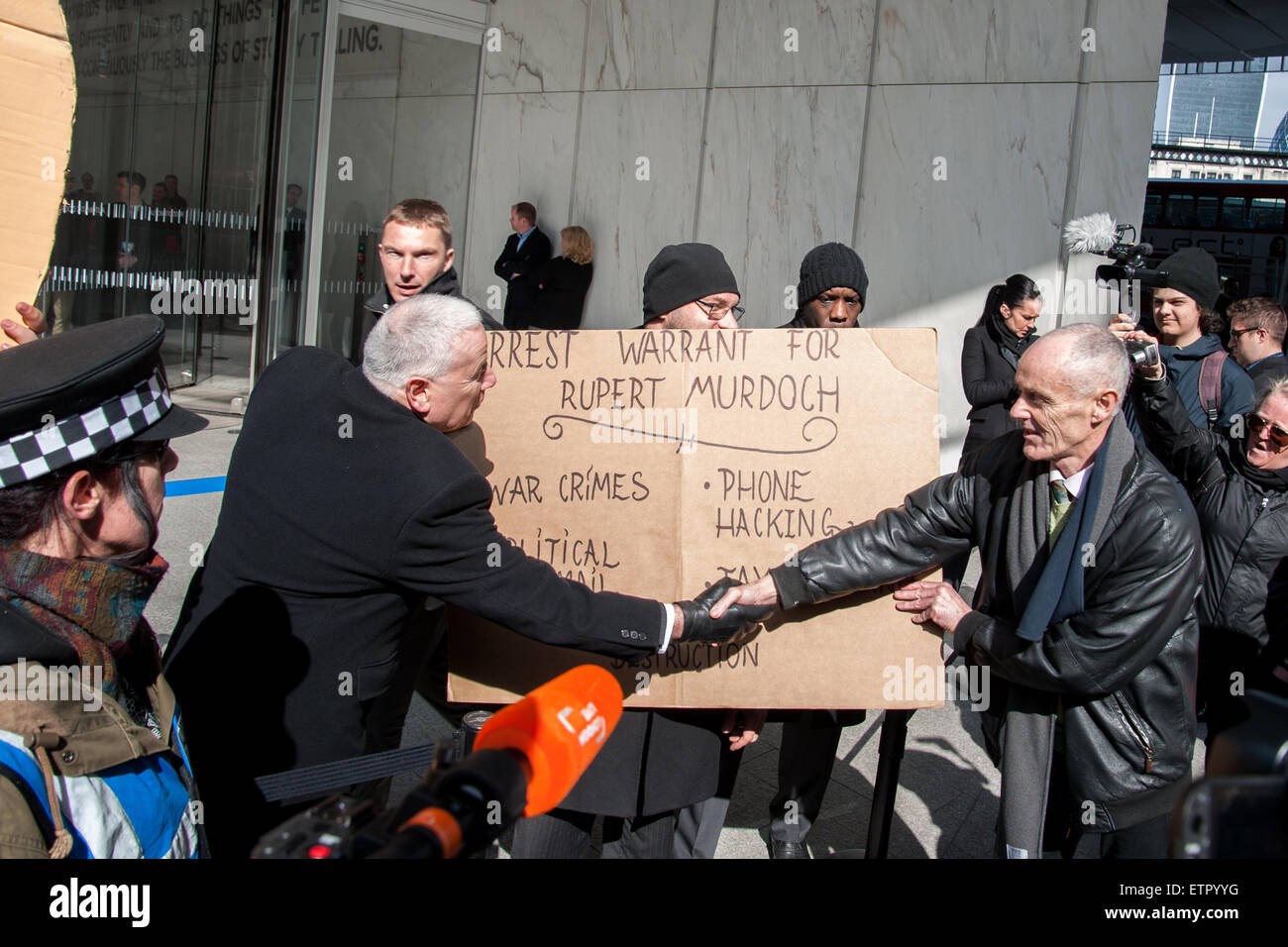 Occupy protesters gather outside the headquarters of News UK, owners of the Sun newspaper to hold an 'Occupy Rupert Murdoch' protest and hand out copies of 'The Occupied Sun.'  Featuring: Donnachadh McCarthy Where: London, United Kingdom When: 23 Mar 2015 Credit: Peter Maclaine/WENN.com Stock Photo