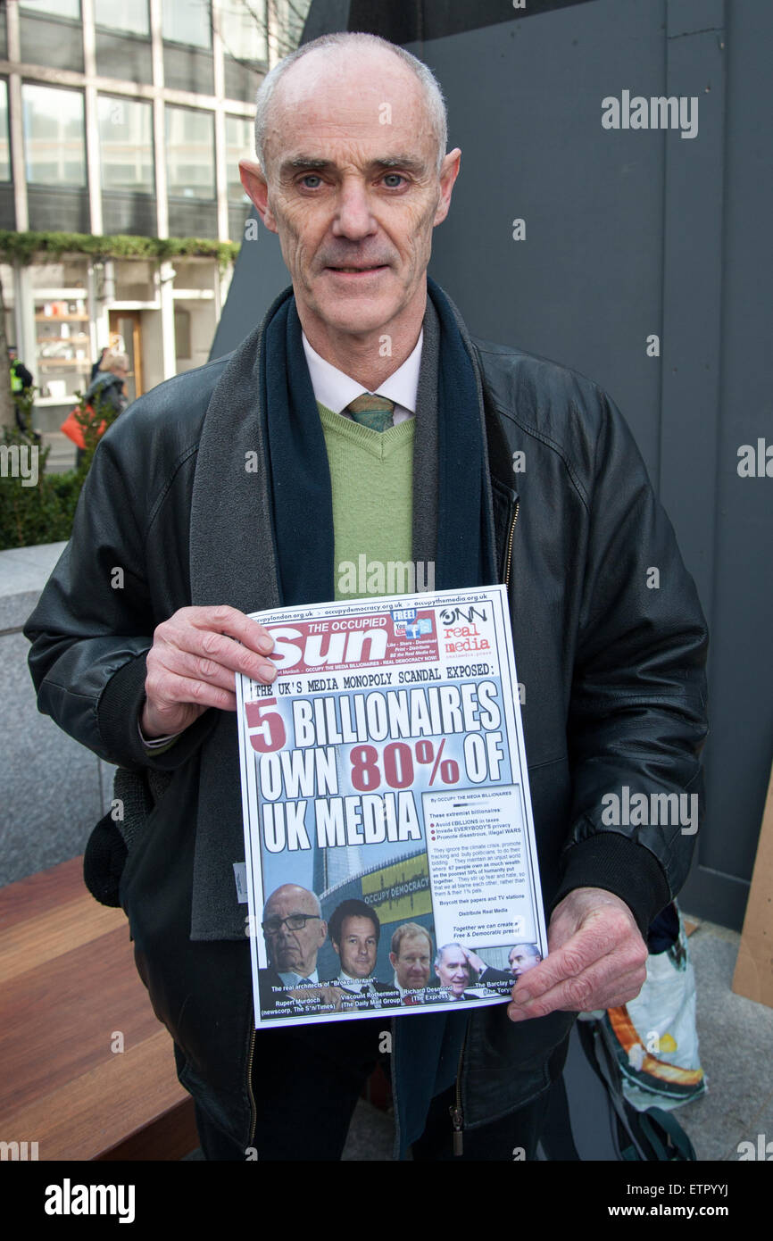 Occupy protesters gather outside the headquarters of News UK, owners of the Sun newspaper to hold an 'Occupy Rupert Murdoch' protest and hand out copies of 'The Occupied Sun.'  Featuring: Donnachadh McCarthy Where: London, United Kingdom When: 23 Mar 2015 Credit: Peter Maclaine/WENN.com Stock Photo
