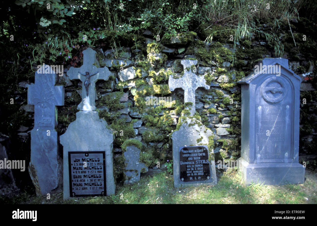 BEL, Belgium, Eastbelgium, Ouren, cemetery at the St. Peters church. BEL, Belgien, Ostbelgien, Ouren, Friedhof an der St. Peter Stock Photo