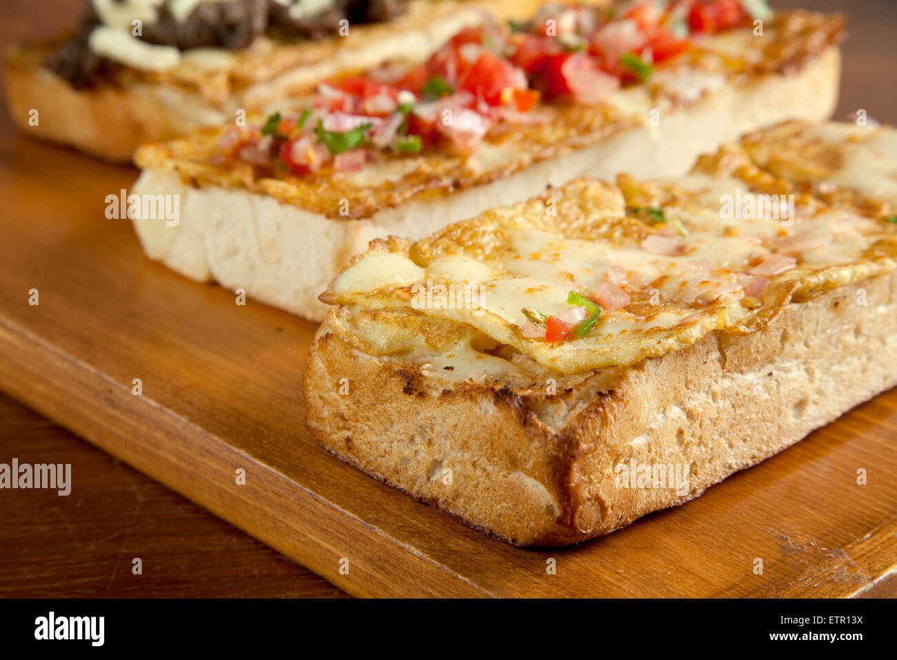 Toasted open faced omelette egg sandwich with melted mozzarella cheese close up Stock Photo