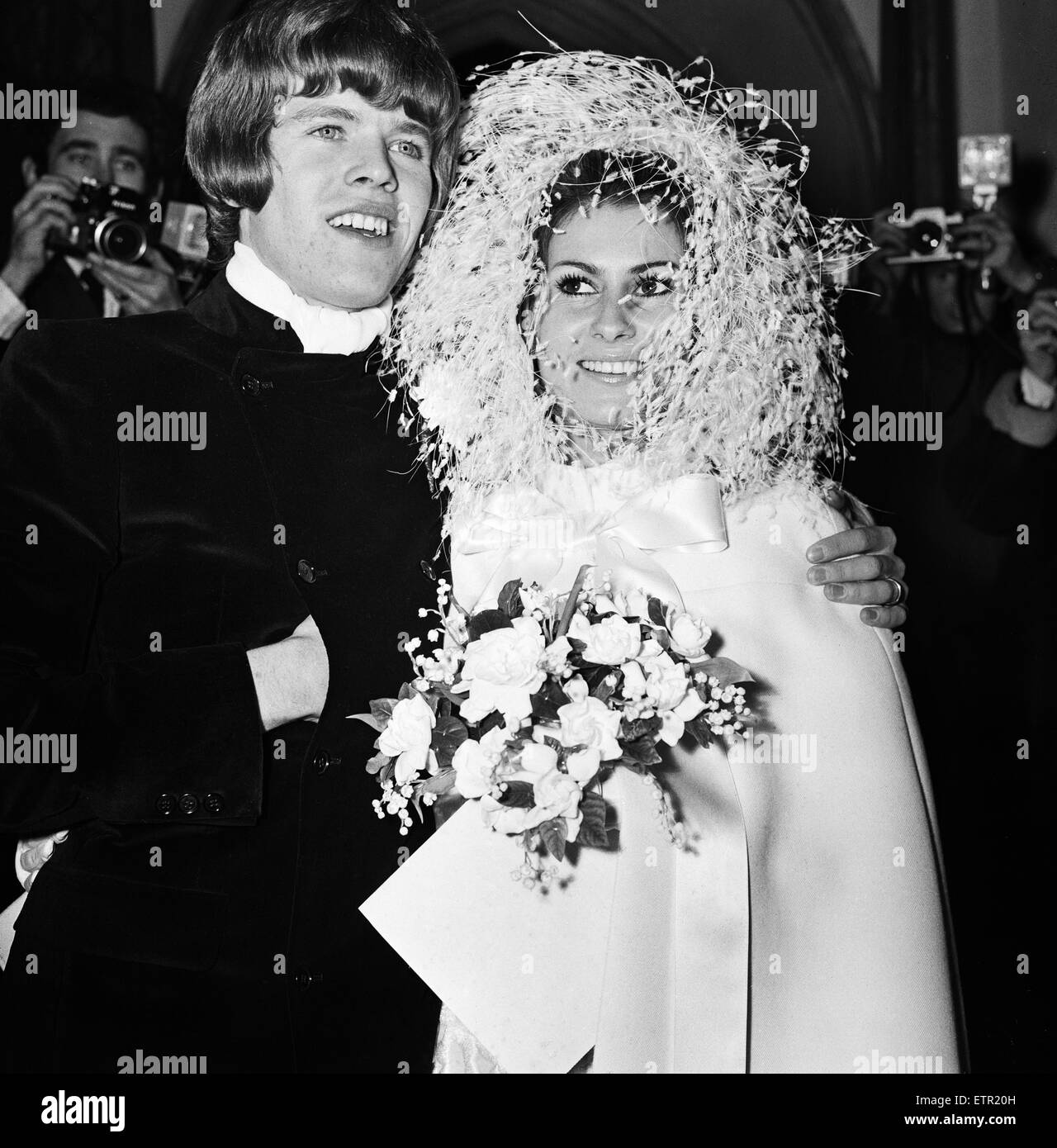 Peter Noone, lead singer of the British pop group Hermans Hermits with his bride Mirielle Strasser during yheir wedding ceremony at the Church of the Immaculate Conception in Farm Street, Mayfair. 5th November 1968. Stock Photo