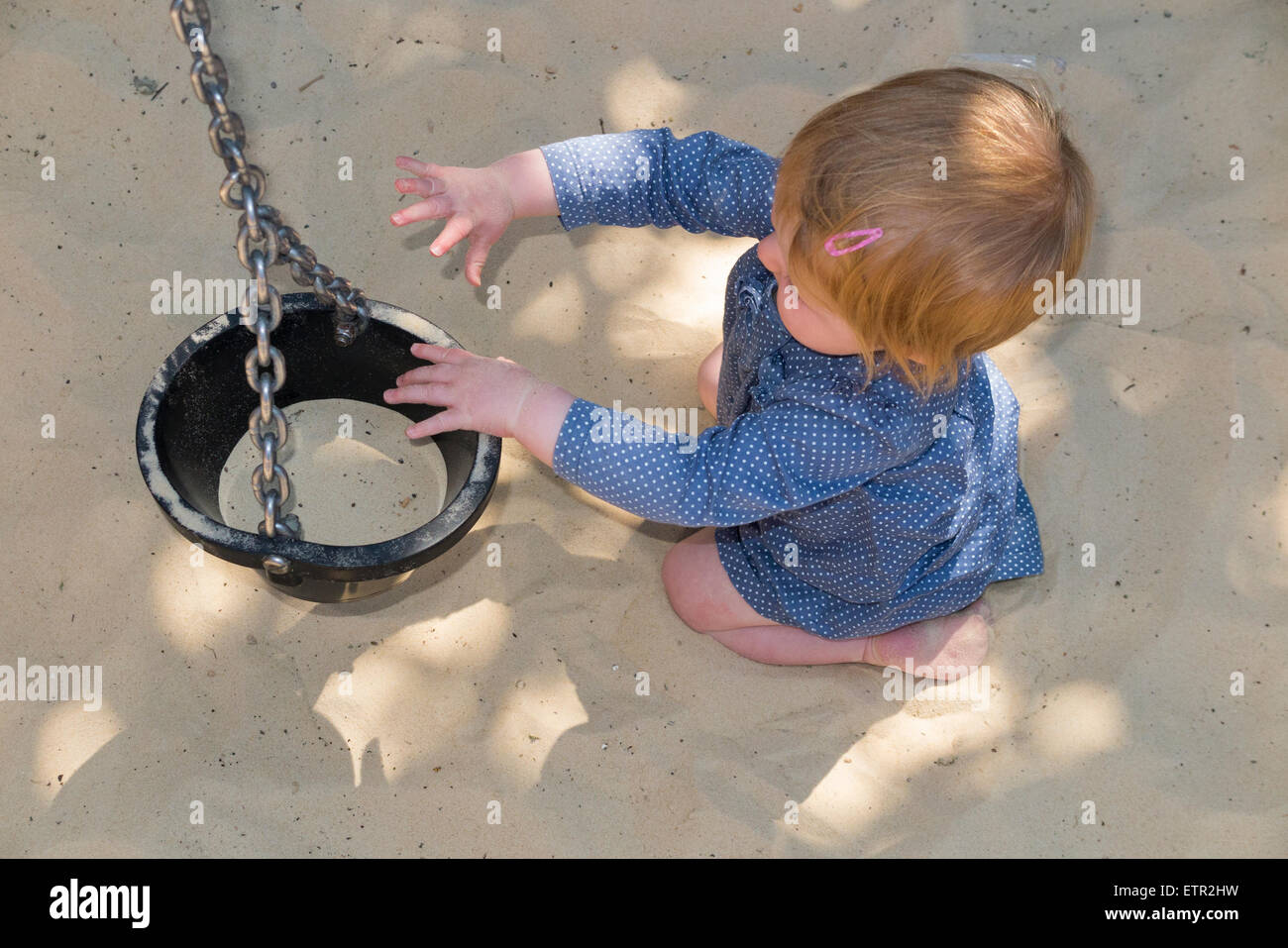 Child / children / baby enjoy activities sand / sand pit / sandpit