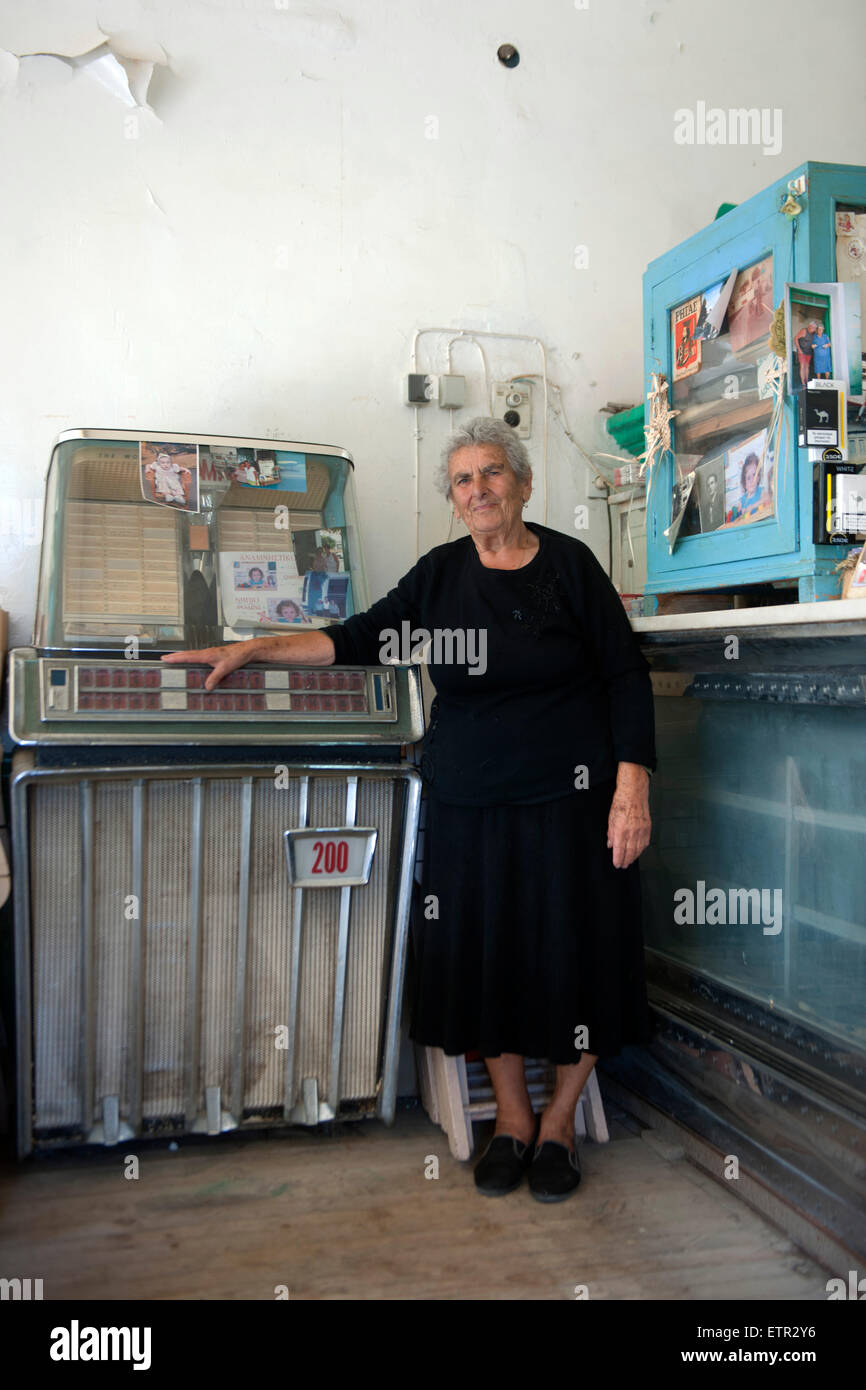 Greece, Rhodes, Kritinia, old Kafenion Platanos at Platia, 84 years old landlady Chrissi Sarikakis Stock Photo